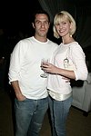 Eric Richman and Eiseley Morgan  at the after party for the movie premiere of 'RIDING GIANTS' at the Southampton home of Andrew Rosen on 7-2-04<br>photo by Rob Rich copyright 2004  516-676-3939
