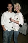 Eric Richman and Eiseley Morgan  at the after party for the movie premiere of 'RIDING GIANTS' at the Southampton home of Andrew Rosen on 7-2-04<br>photo by Rob Rich copyright 2004  516-676-3939