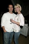 Eric Richman and Eiseley Morgan  at the after party for the movie premiere of 'RIDING GIANTS' at the Southampton home of Andrew Rosen on 7-2-04<br>photo by Rob Rich copyright 2004  516-676-3939