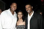 NY Giant Michael Strahan, Tirste' Lieteau, and Dr. Ian Smith<br>at the after party for the movie premiere of 'RIDING GIANTS' at the Southampton home of Andrew Rosen on 7-2-04<br>photo by Rob Rich copyright 2004  516-676-3939 