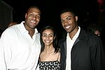 NY Giant Michael Strahan, Tirste' Lieteau, and Dr. Ian Smith<br>at the after party for the movie premiere of 'RIDING GIANTS' at the Southampton home of Andrew Rosen on 7-2-04<br>photo by Rob Rich copyright 2004  516-676-3939 