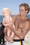 Reece Viola Hamilton with surfer dad Laird Hamilton<br> at the 'Riding Giants' beach party at the Watermill ocean front residence of Alex von Furstenberg on 7-3-04<br>photos by Rob Rich copyright 2004  516-676-3939