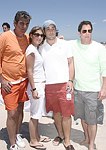 Andrew Rosen, David and Ashley Goldberg, and Danny Beagle at the 'Riding Giants' beach party at the Watermill ocean front residence of Alex von Furstenberg on 7-3-04<br>photos by Rob Rich copyright 2004  516-676-3939